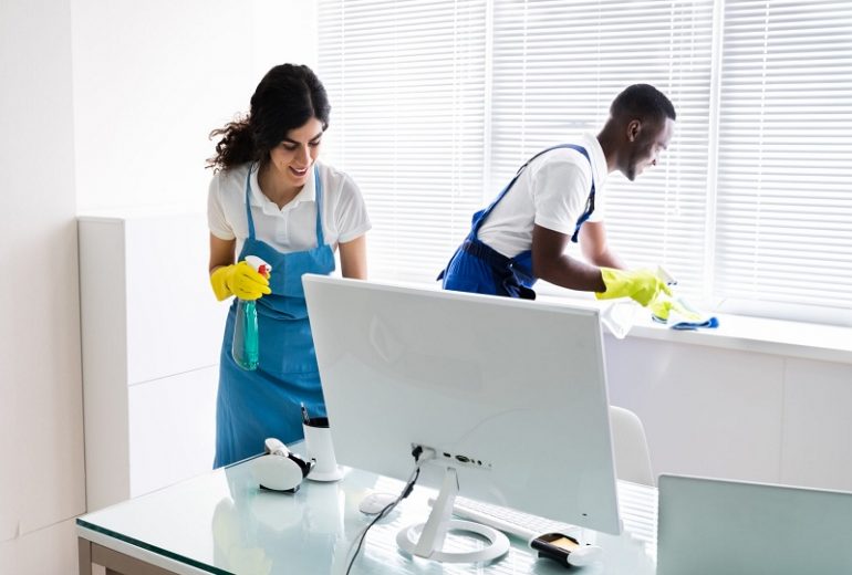 Colleagues Cleaning Office