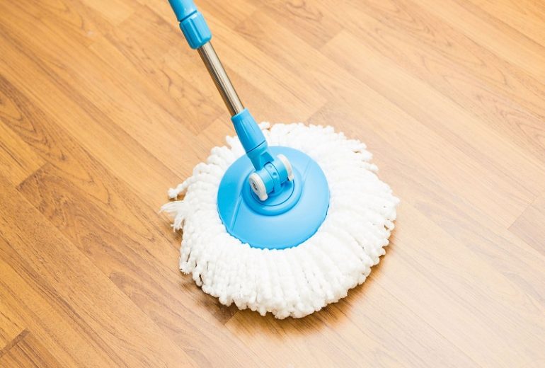 Cleaning office with mop