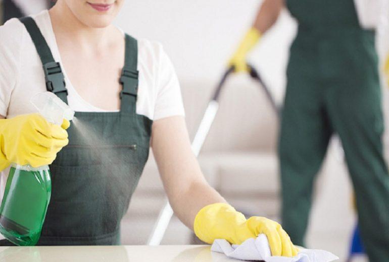 Women Cleaning Table